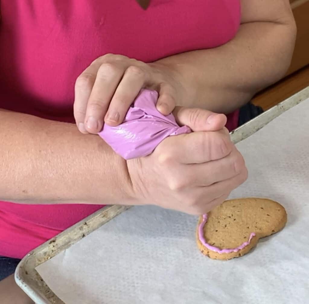 applying frosting DIY dog treats