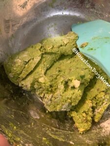 green dough for homemade dog treats with spatula