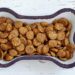 learn about dog nutrition. photo shows bone shaped bowl with kibble.